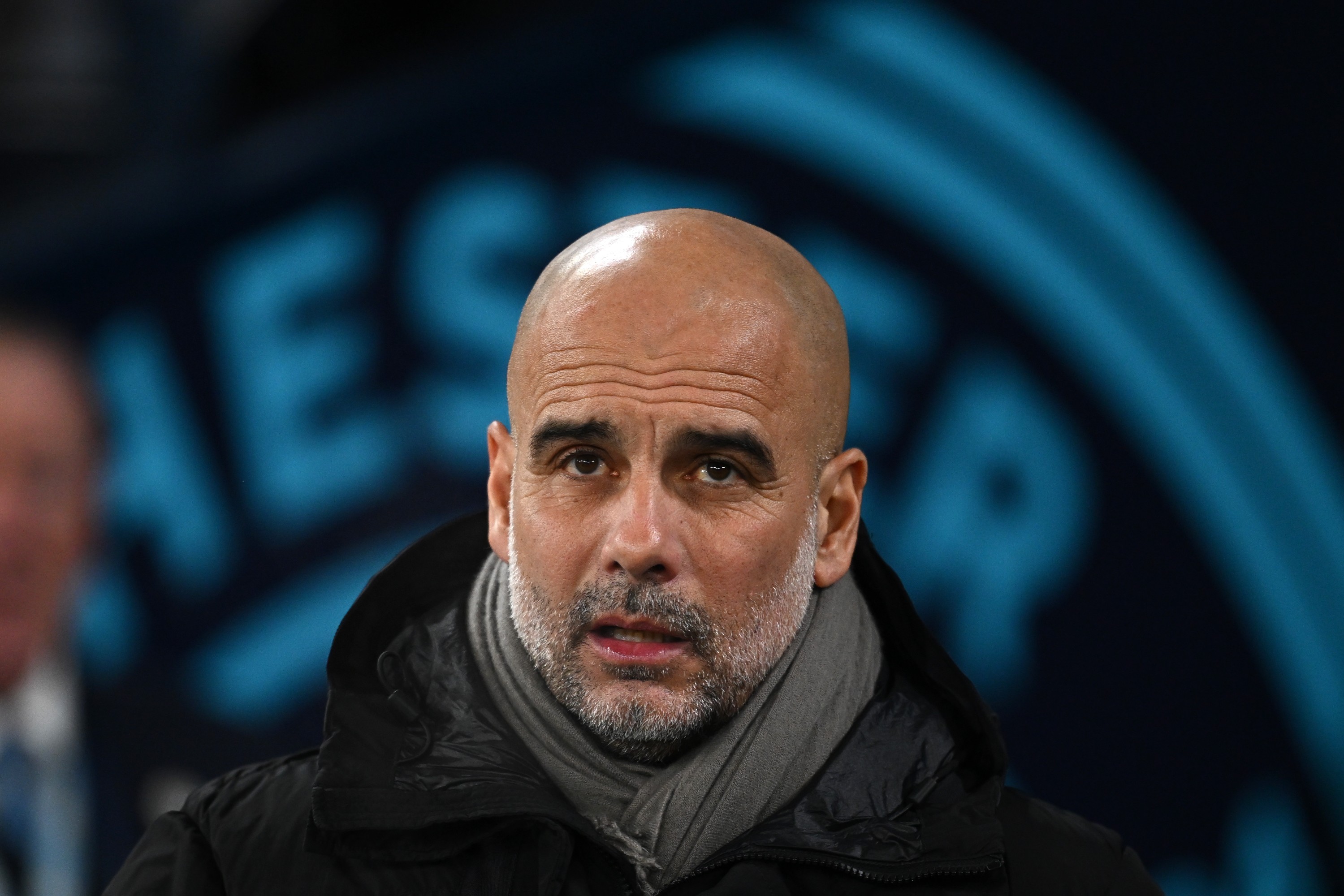 Pep Guardiola, Manager of Manchester City, looks on