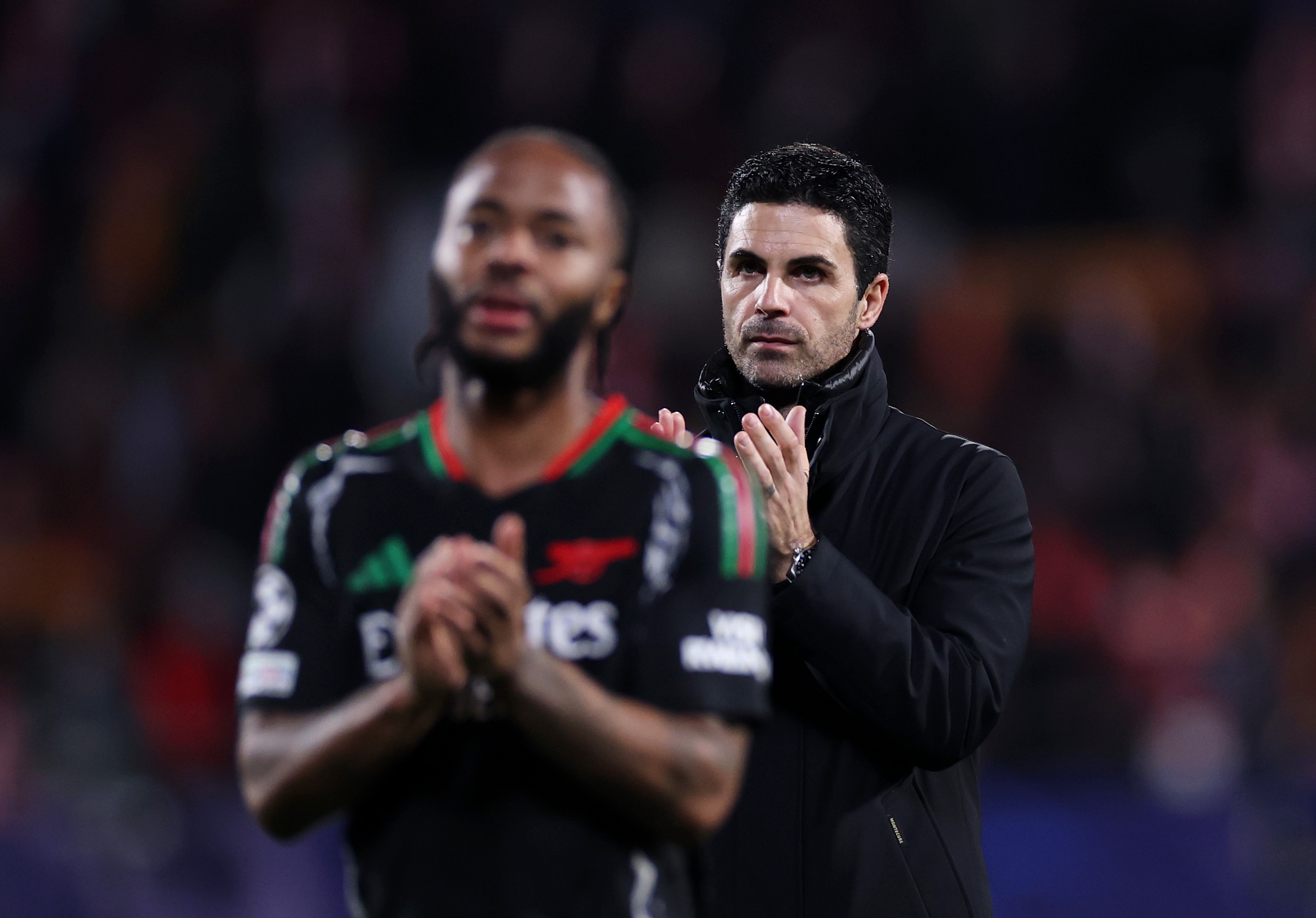 Mikel Arteta and Raheem Sterling of Arsenal applaud the fans