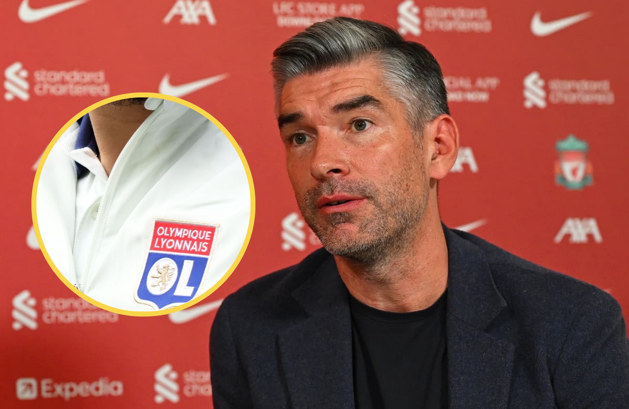 Richard Hughes listens during Liverpool press conference next to picture of Rayan Cherki's tracksuit.