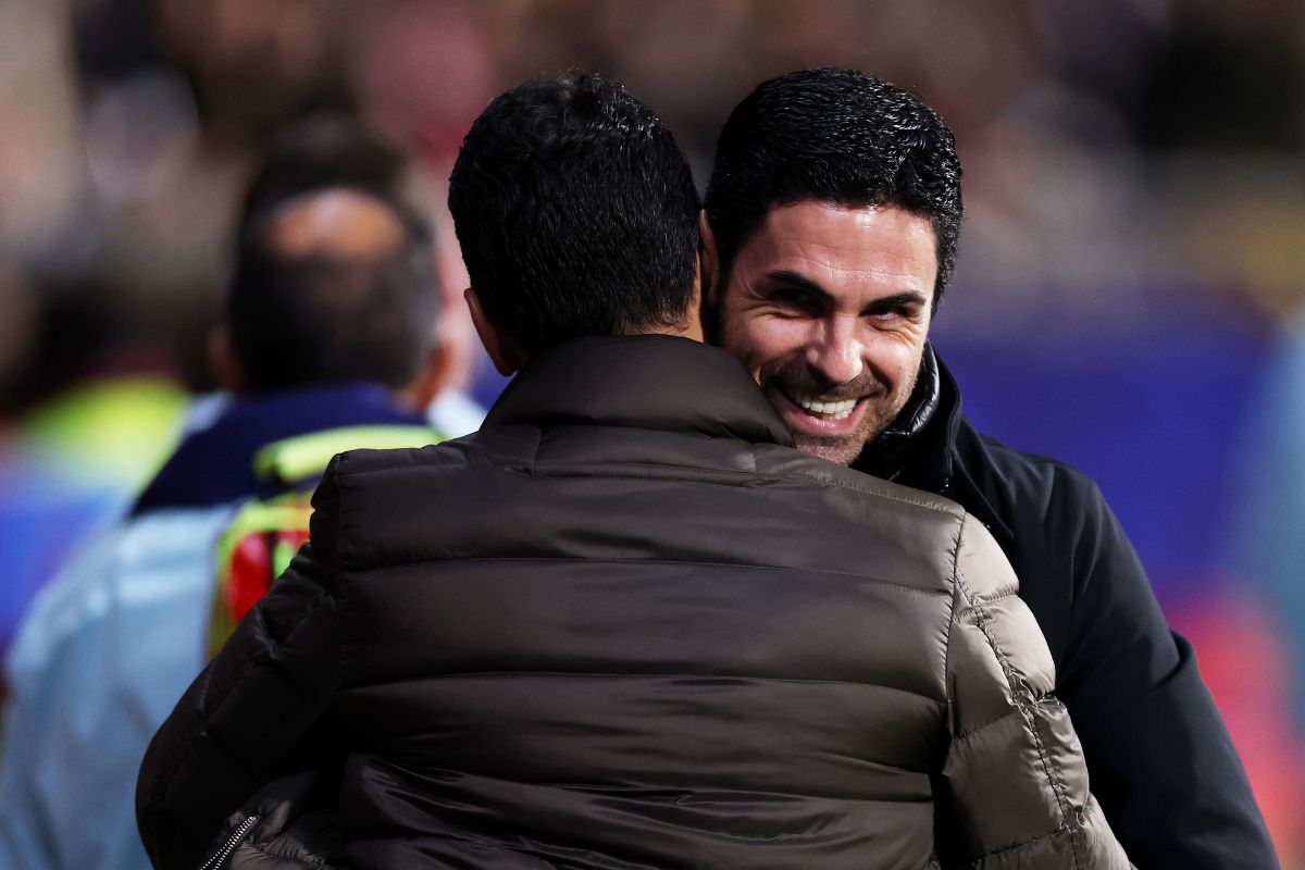 Michel, Head Coach of Girona FC, and Mikel Arteta, Manager of Arsenal, embrace
