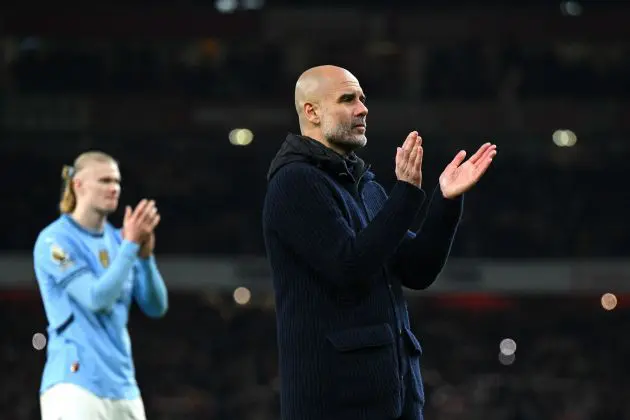 Pep Guardiola, Manager of Manchester City, looks dejected