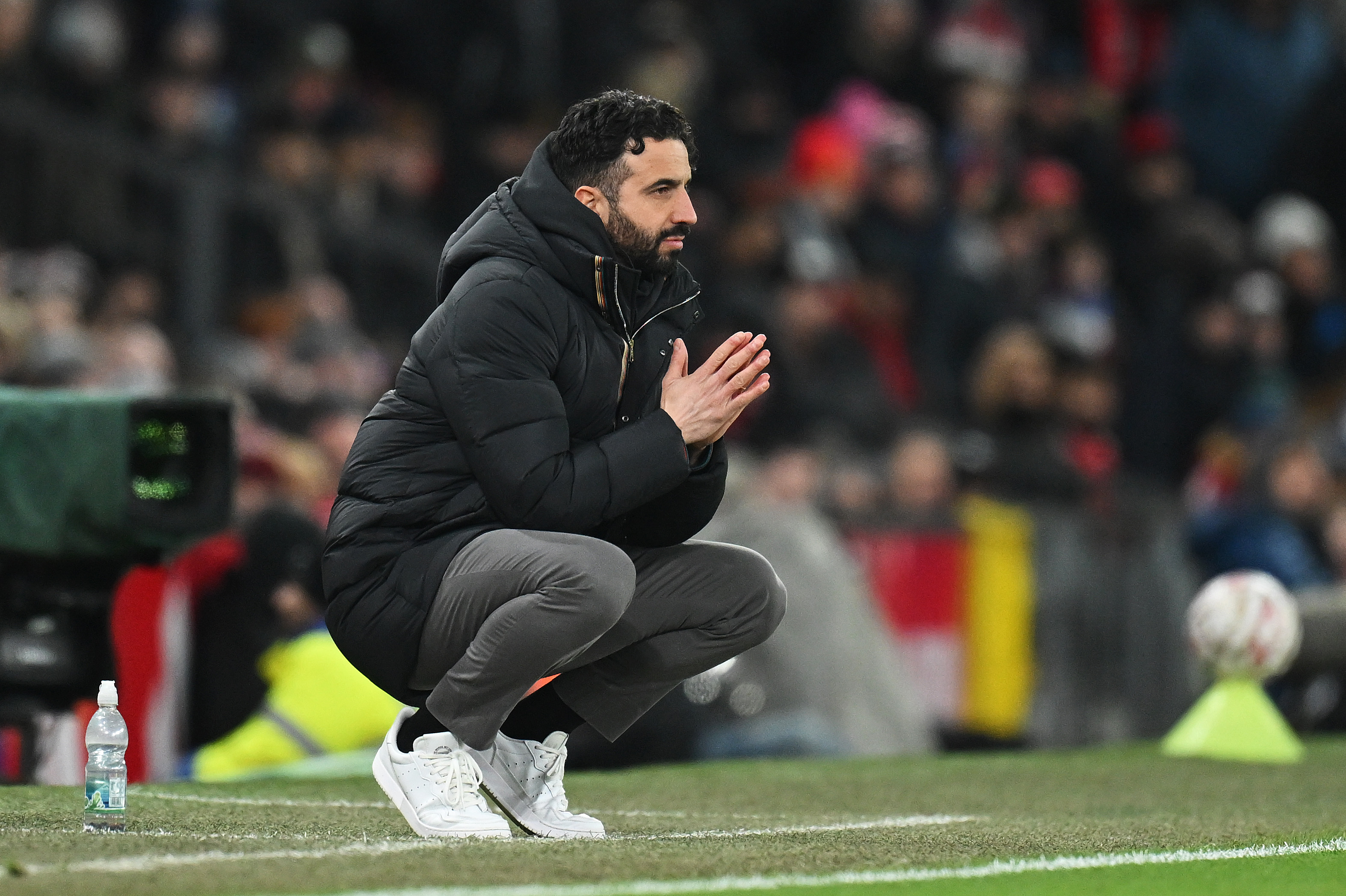 Ruben Amorim sits on the touchline