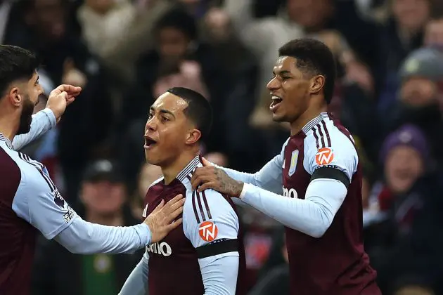 Youri Tielemans of Aston Villa celebrates scoring his team's first goal with teammates Marco Asensio and Marcus Rashford