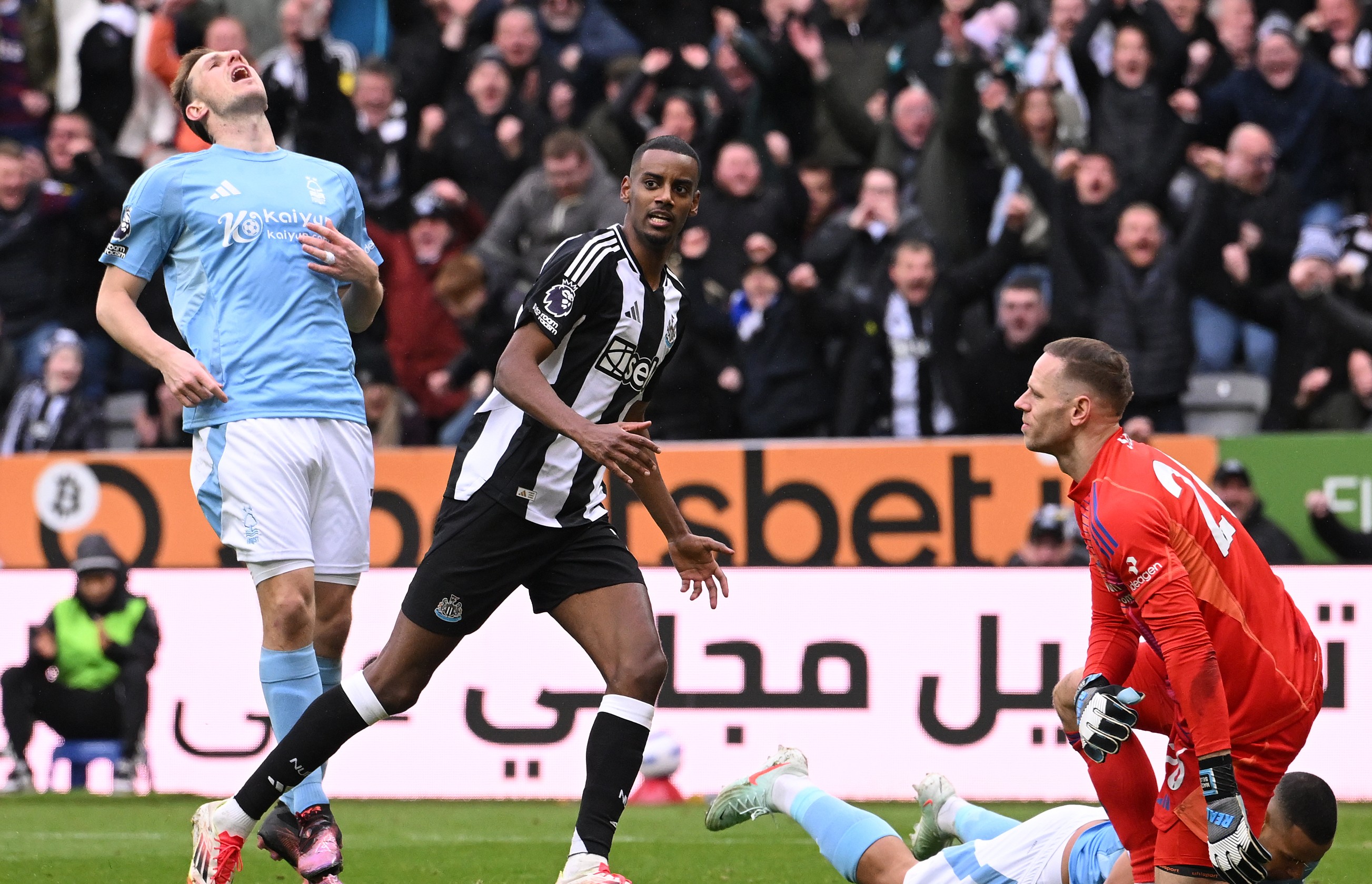 Alexander Isak of Newcastle races off to celebrate after scoring the fourth goal against Nottingham Forest.