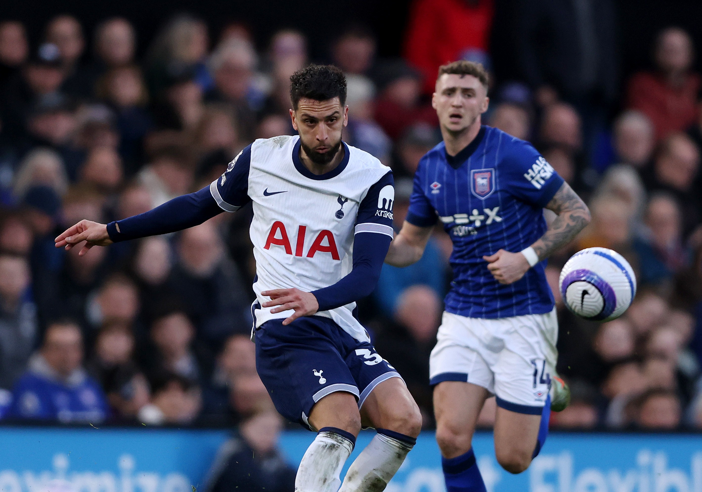 Rodrigo Bentancur of Tottenham Hotspur is put under pressure
