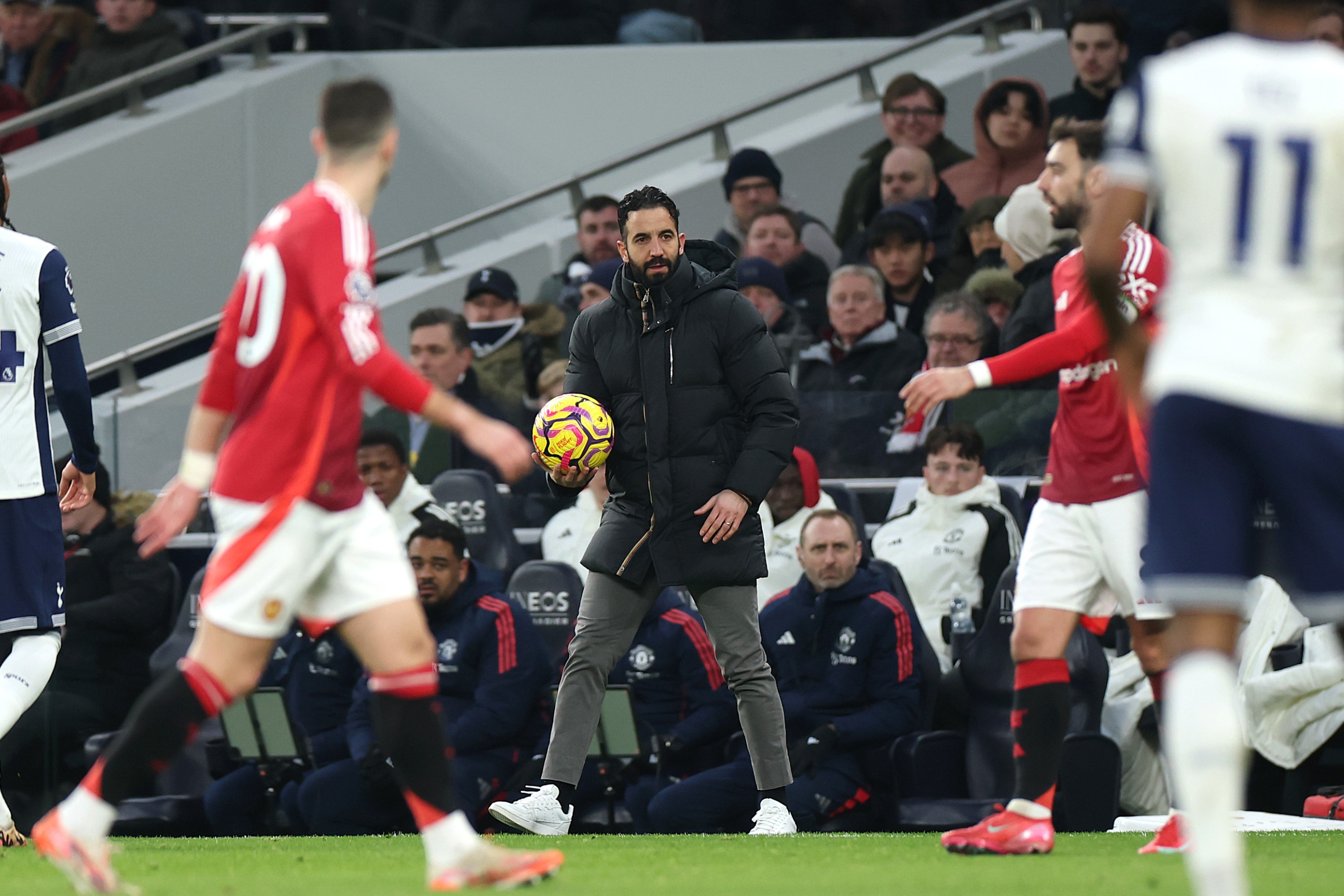 Ruben Amorim, Head Coach of Manchester United, catches the ball during the Premier League match against Tottenham Hotspur