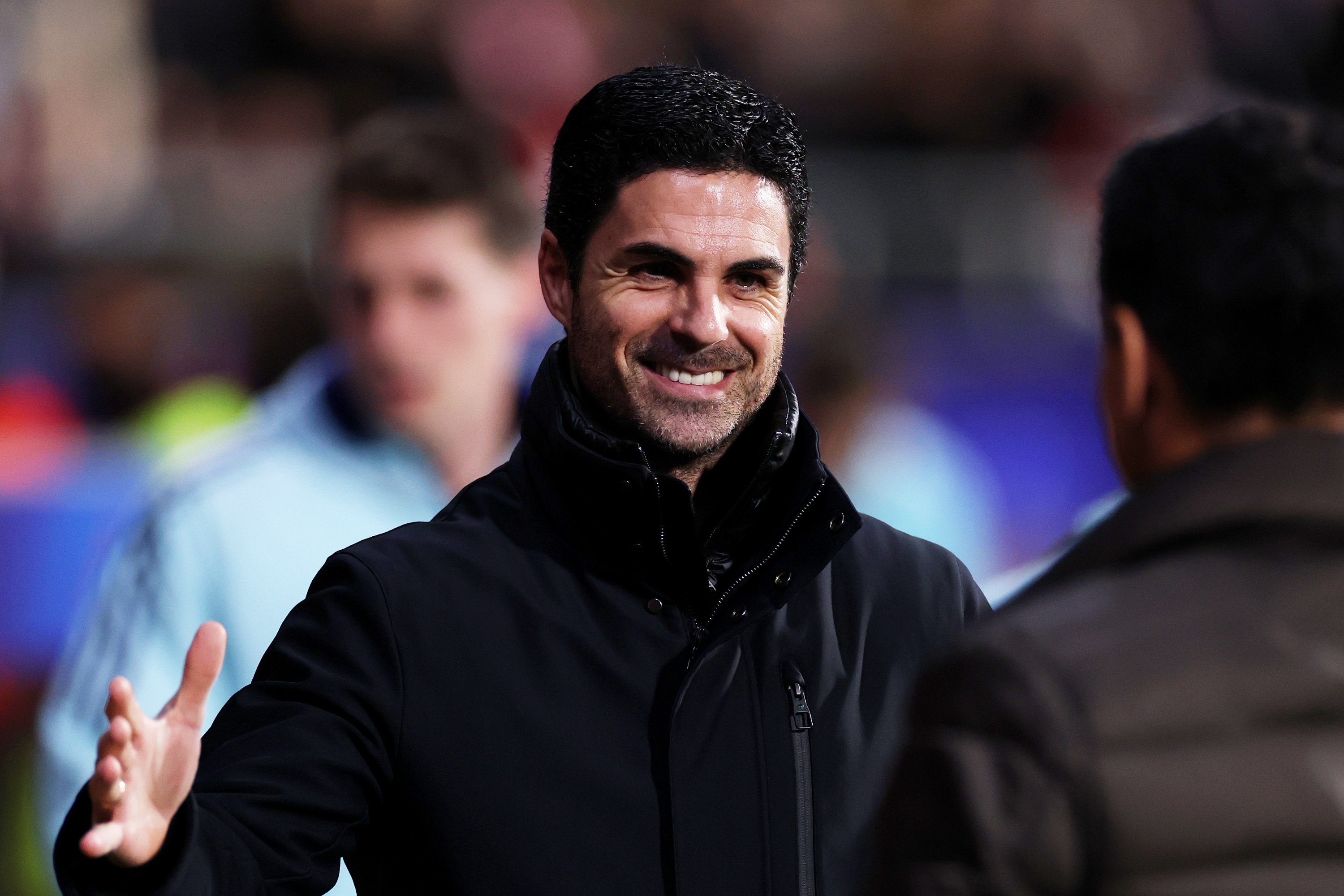 Mikel Arteta, Manager of Arsenal, and Michel, Head Coach of Girona FC, interact
