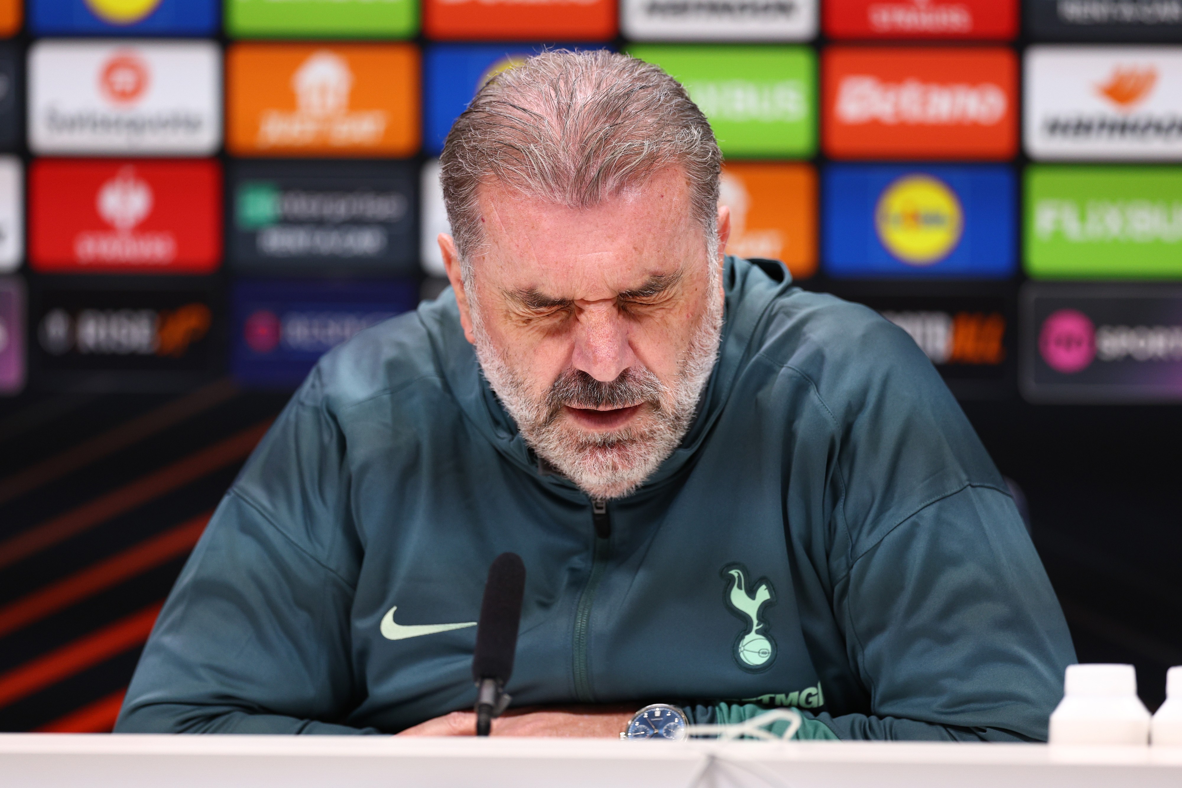Tottenham manager Ange Postecoglou faces the media