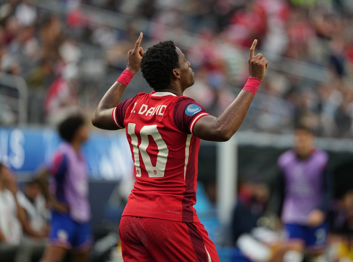 Jonathan David celebrates a goal for Canada