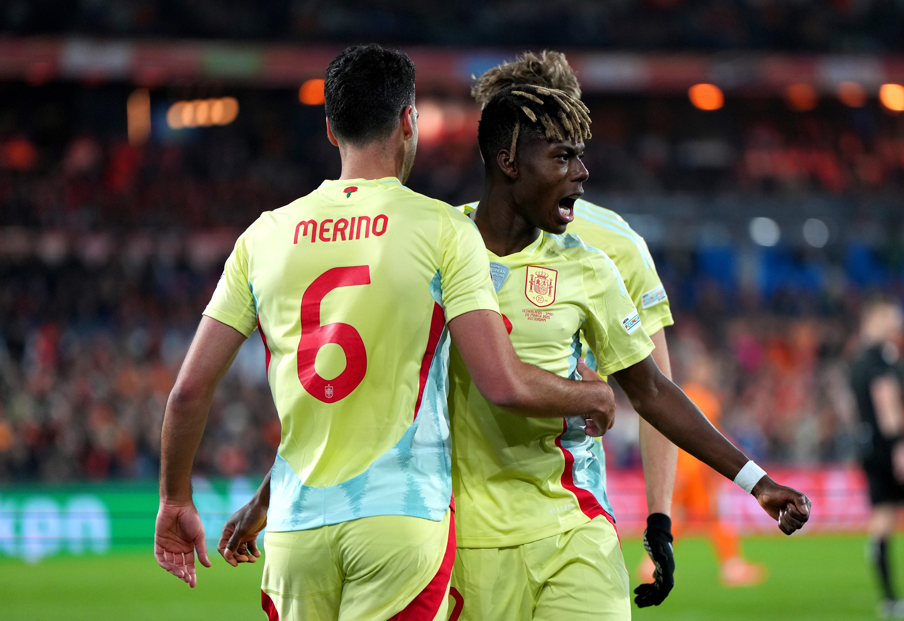 Nico Williams hugs Mikel Merino after Spain goal.
