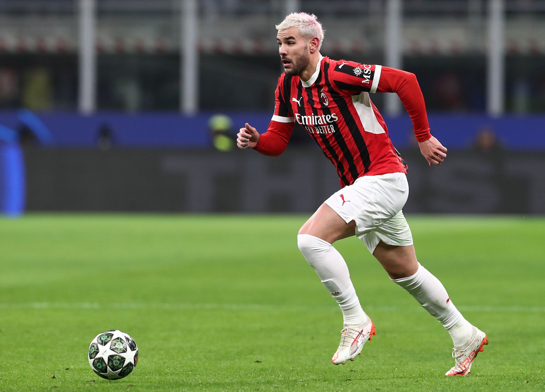 Theo Hernandez runs with the ball
