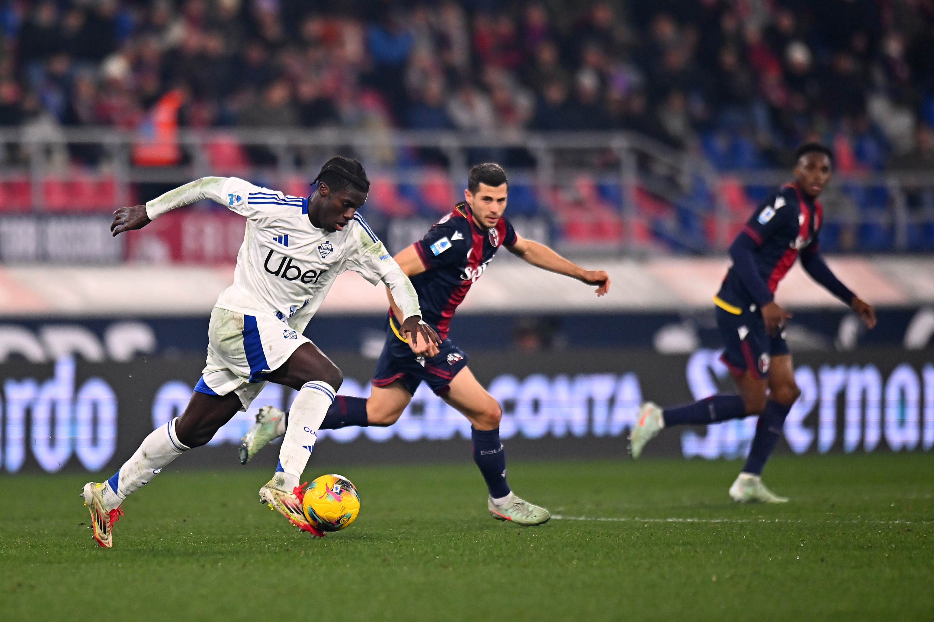 Assane Diao of Como runs with the ball