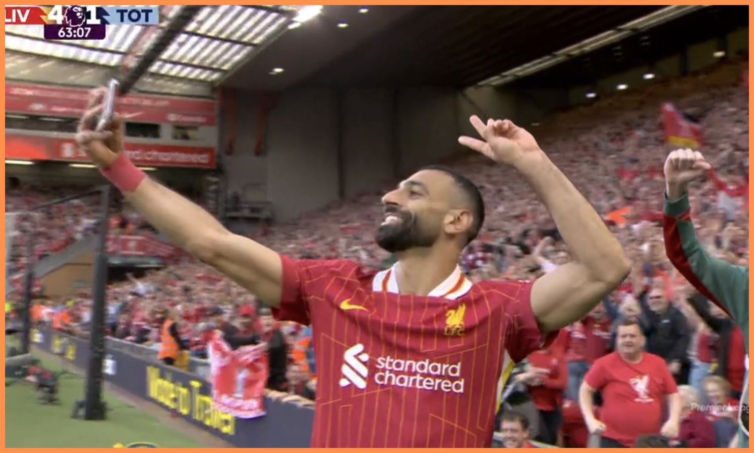 Mohamed Salah celebrates with a selfie after scoring for Liverpool against Tottenham