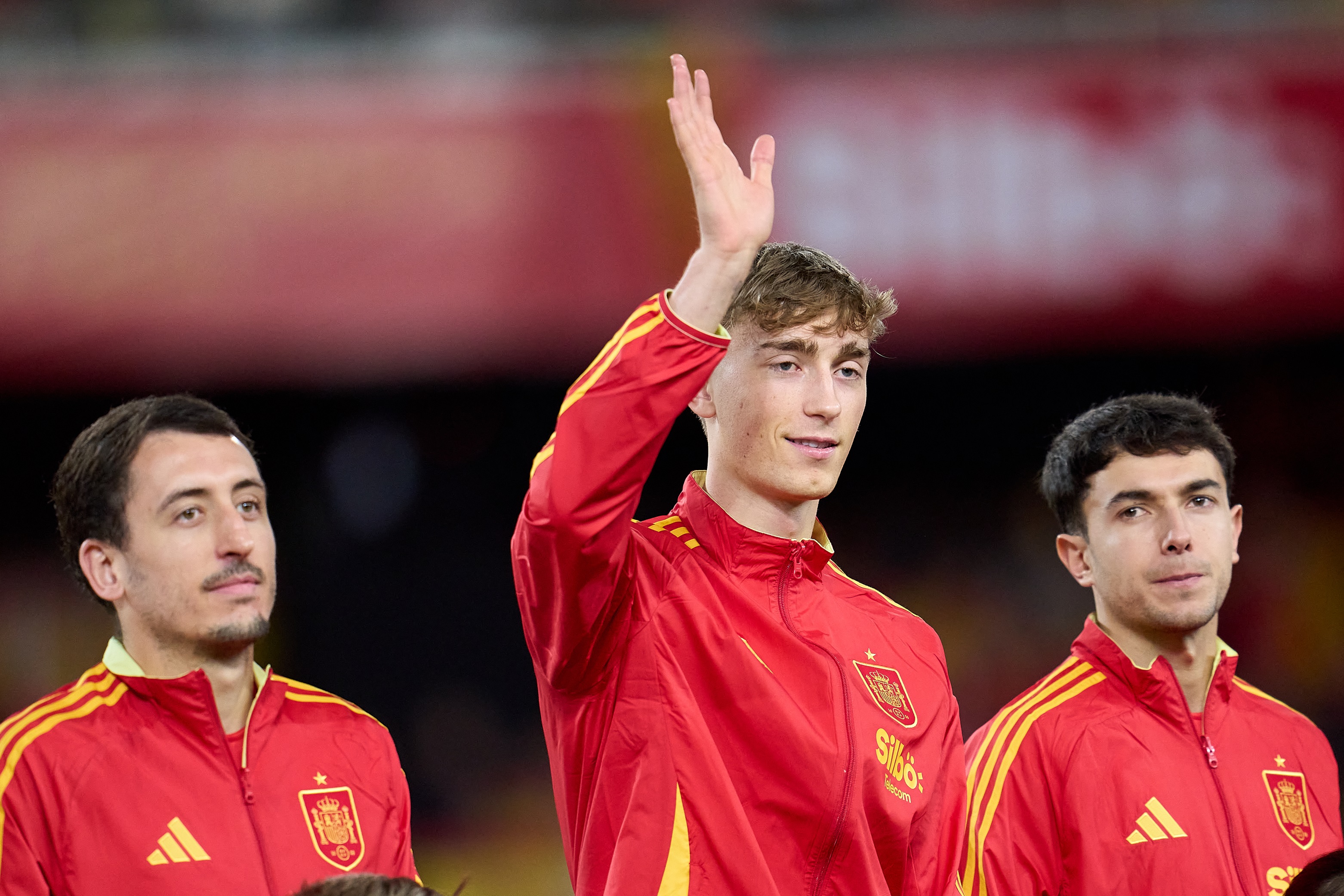 Dean Huijsen waves at fans on Spain international duty.