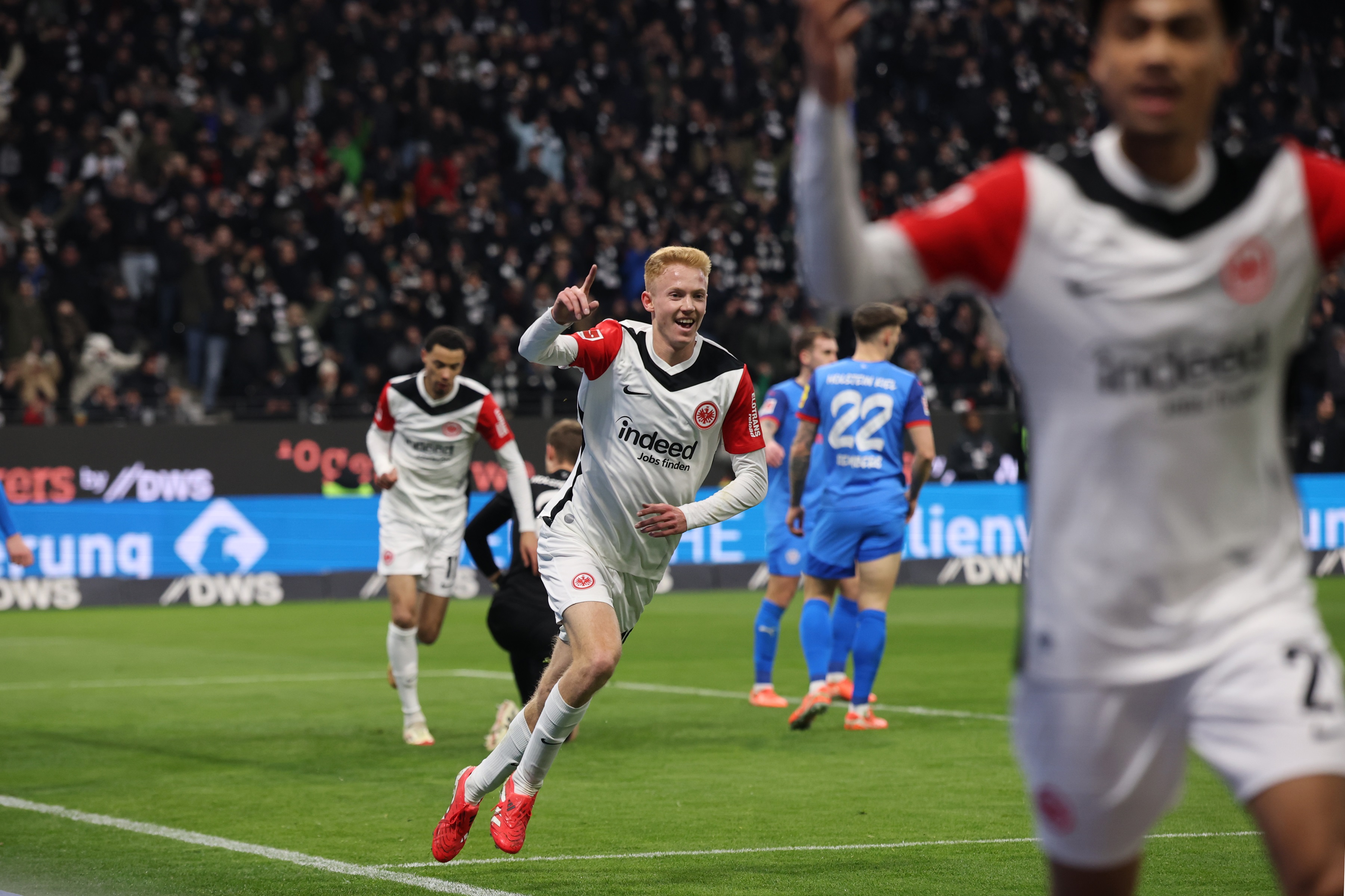 Hugo Larsson wheels away in celebration after Frankfurt goal.