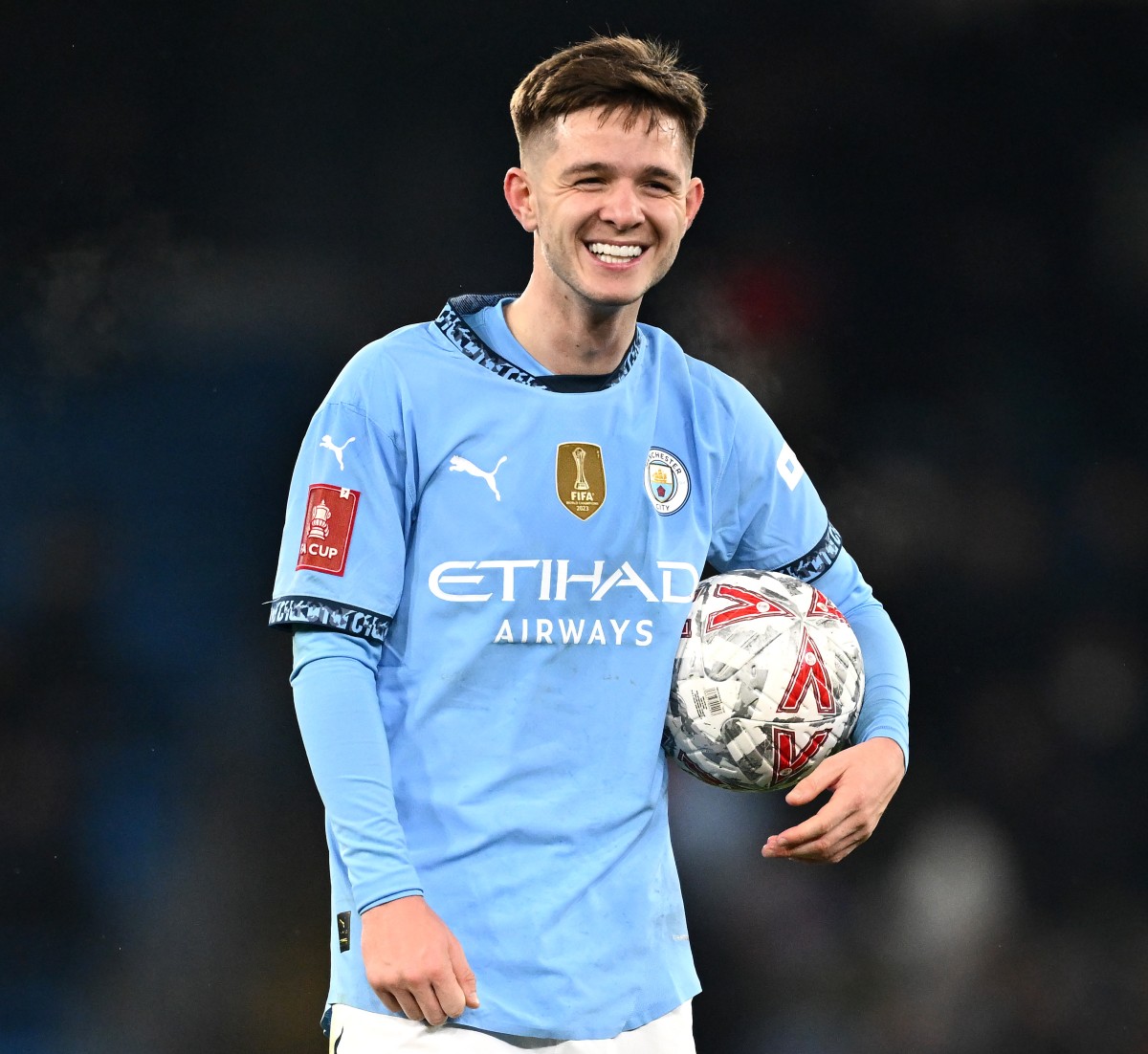Man City's James McAtee with the match ball