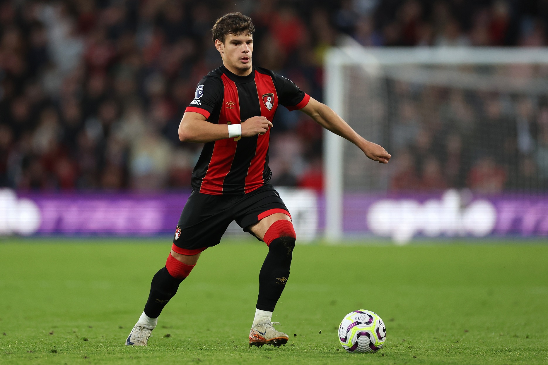 Milos Kerkez of Bournemouth runs with the ball