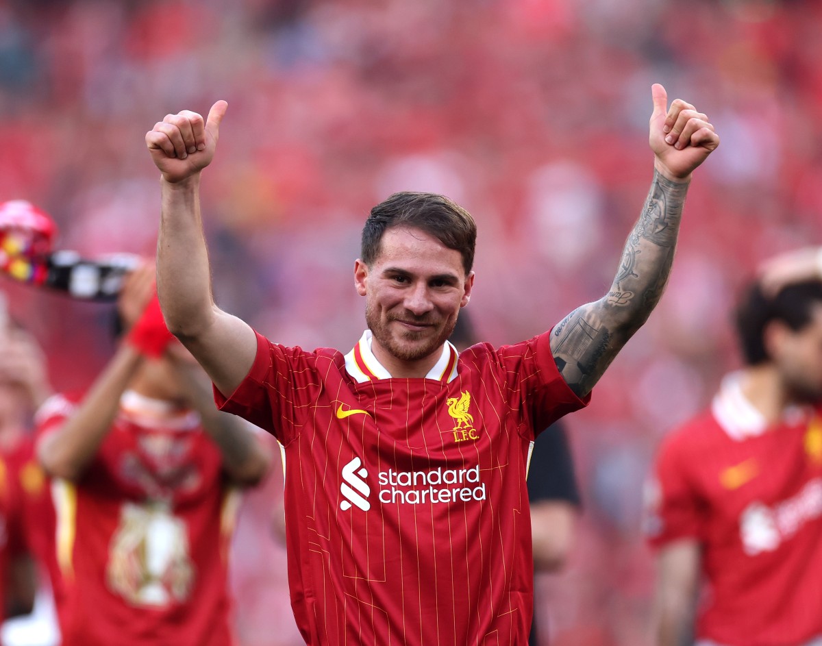 Alexis Mac Allister celebrates after Liverpool win the Premier League title