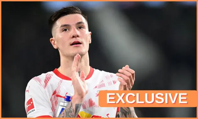 Benjamin Sesko claps his hands during Bundesliga game.
