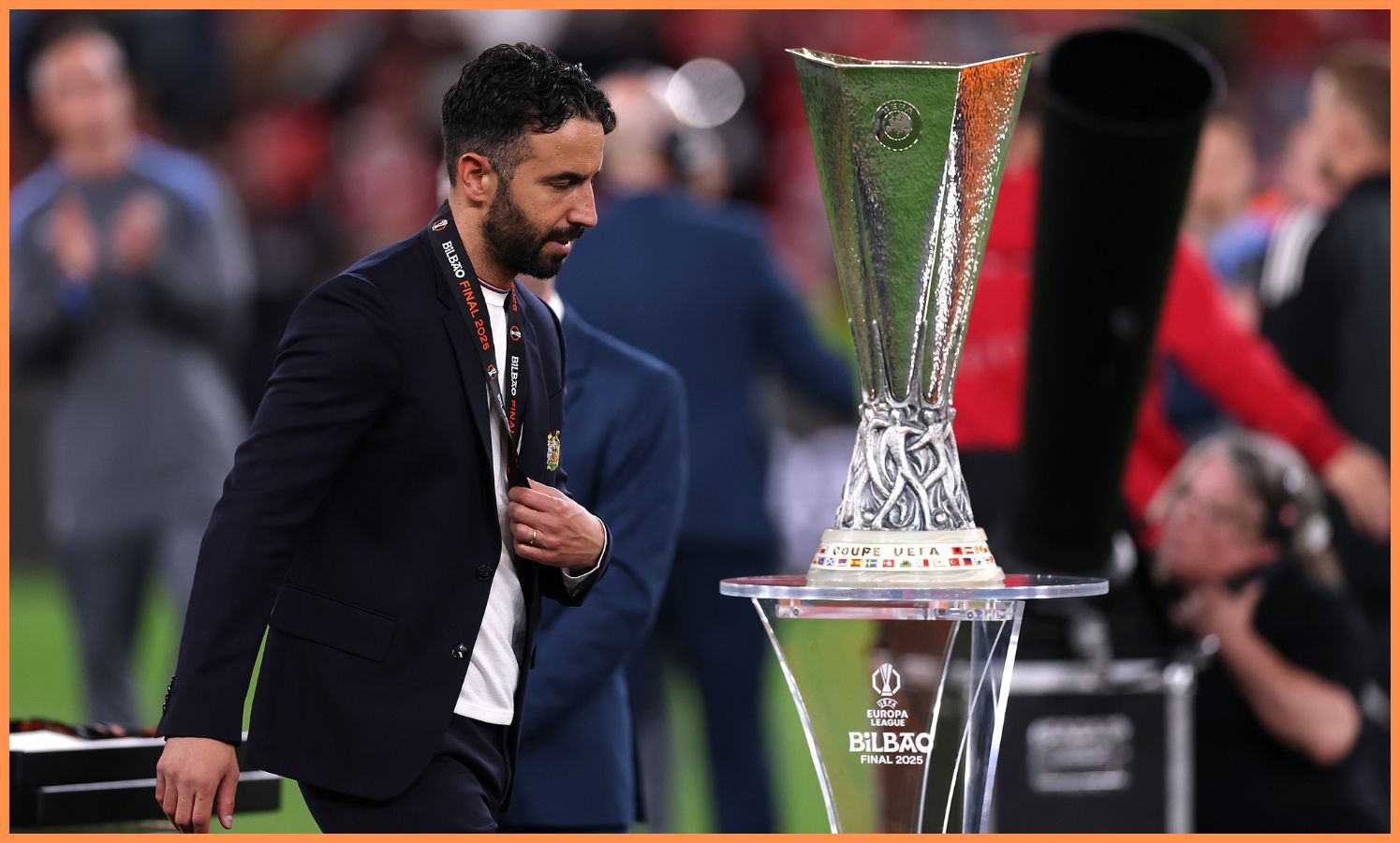 Ruben Amorim walks past the Europa League trophy after losing the final against Tottenham