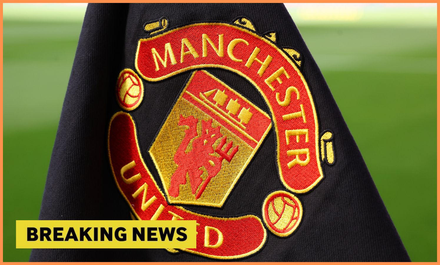 Manchester United flag plus 'breaking news' banner