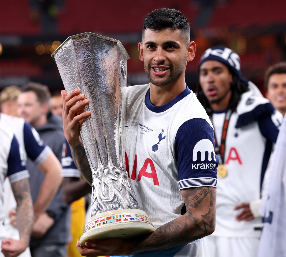 Cristian Romero with the Europa League trophy