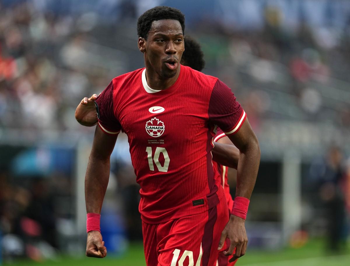 Jonathan David celebrates scoring for the Canadian national team