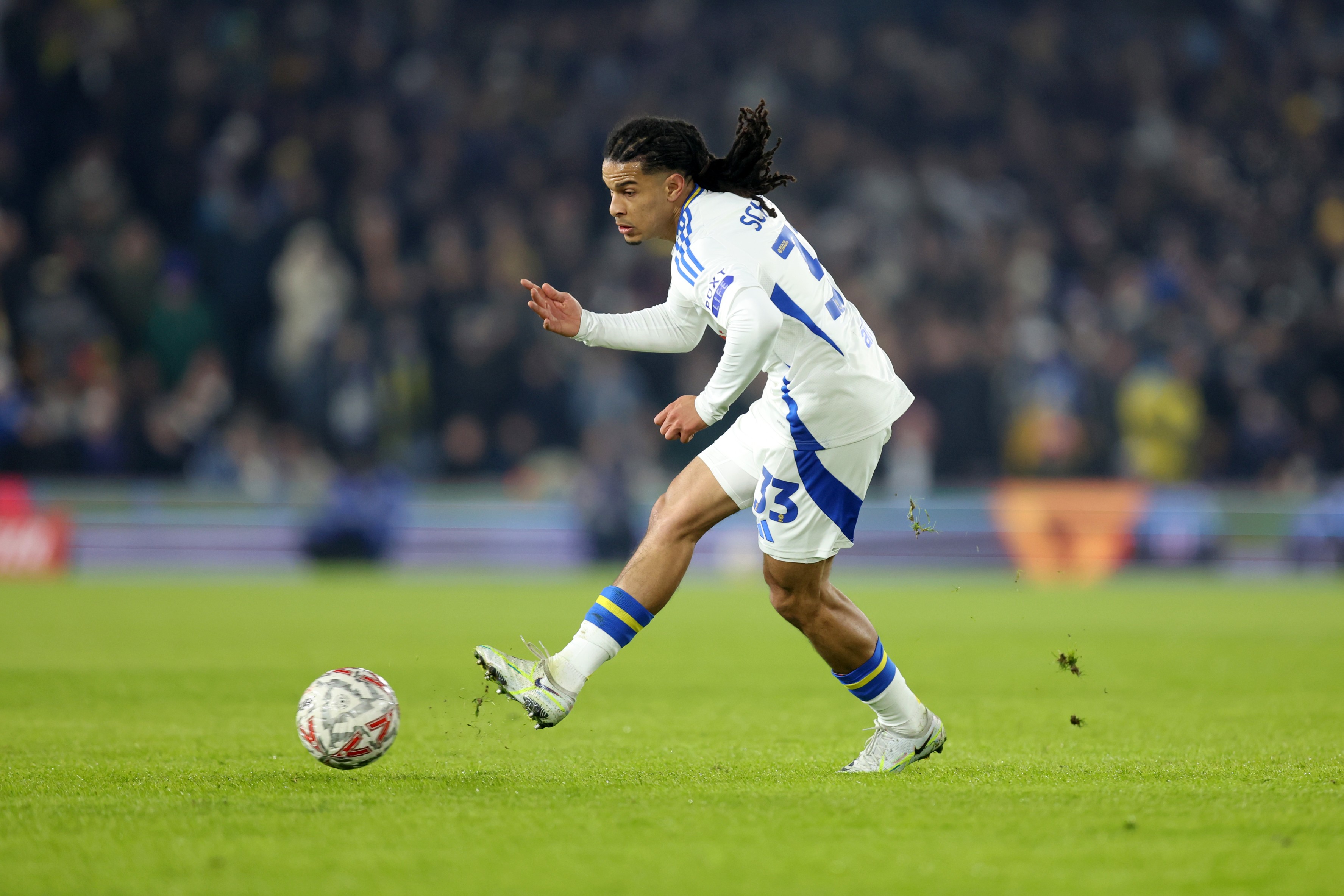 Isaac Schmidt of Leeds United passes the ball