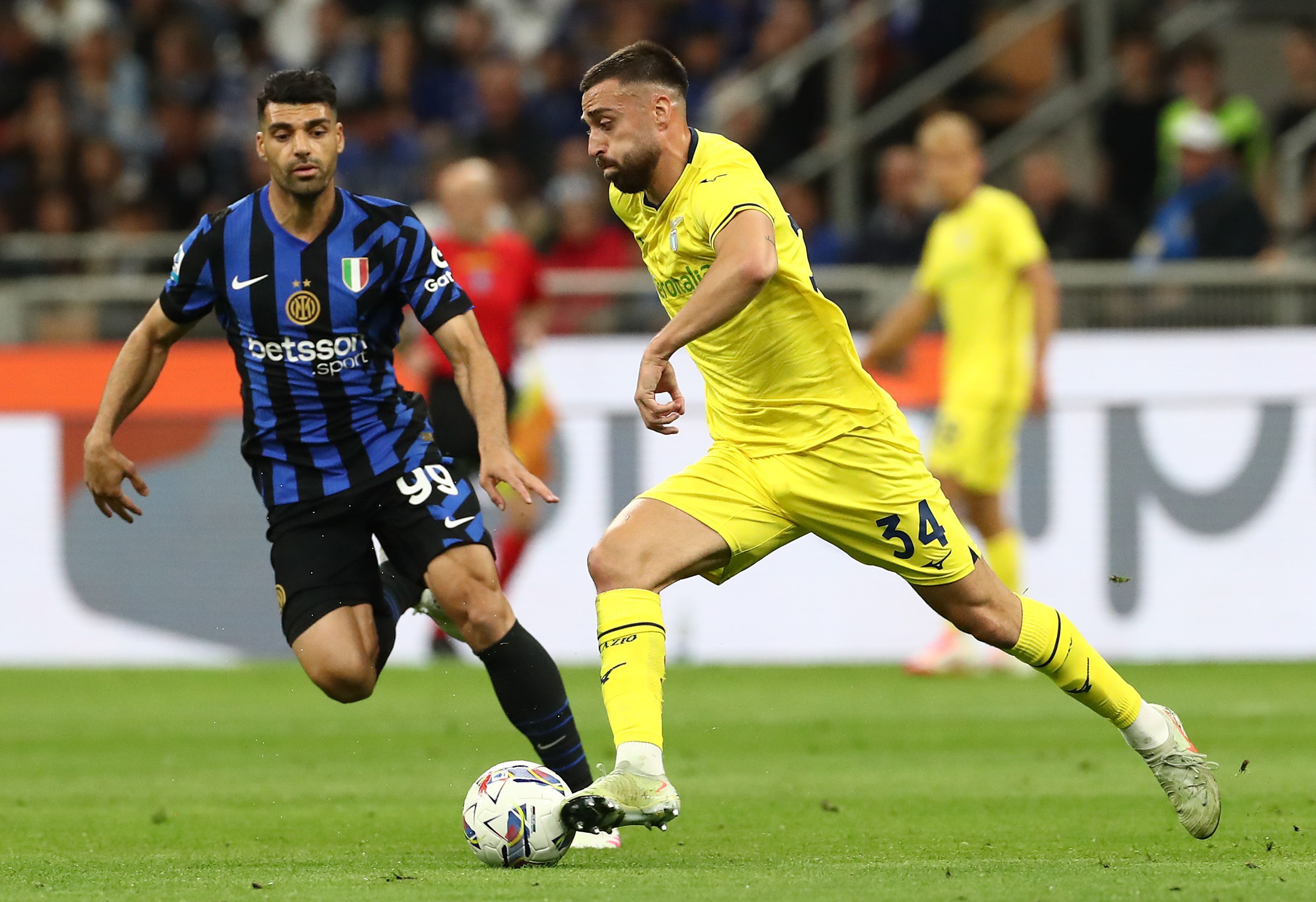 Mario Gila of SS Lazio is pressured by Mehdi Taremi of FC Internazionale
