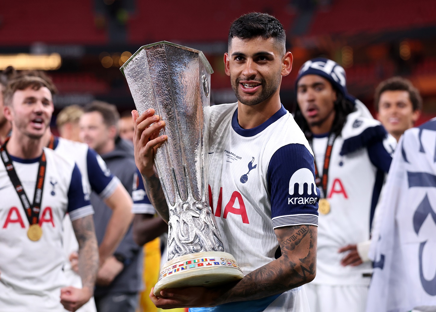 Cristian Romero with the Europa League trophy