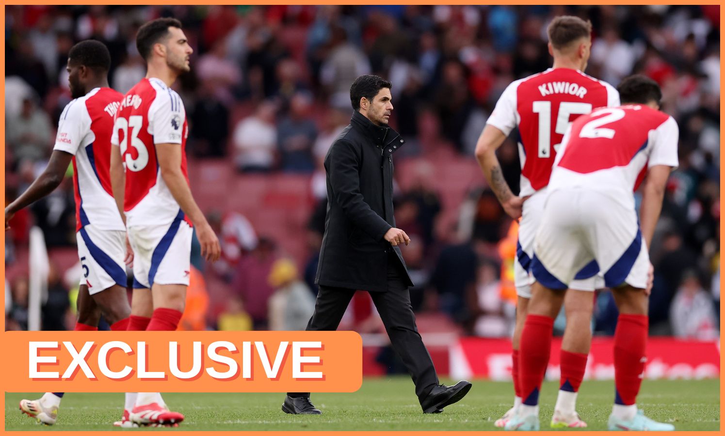 Mikel Arteta and Arsenal's players react after losing to Bournemouth at the Emirates Stadium