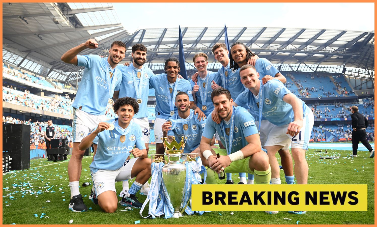 Manchester City players celebrate with the Premier League trophy