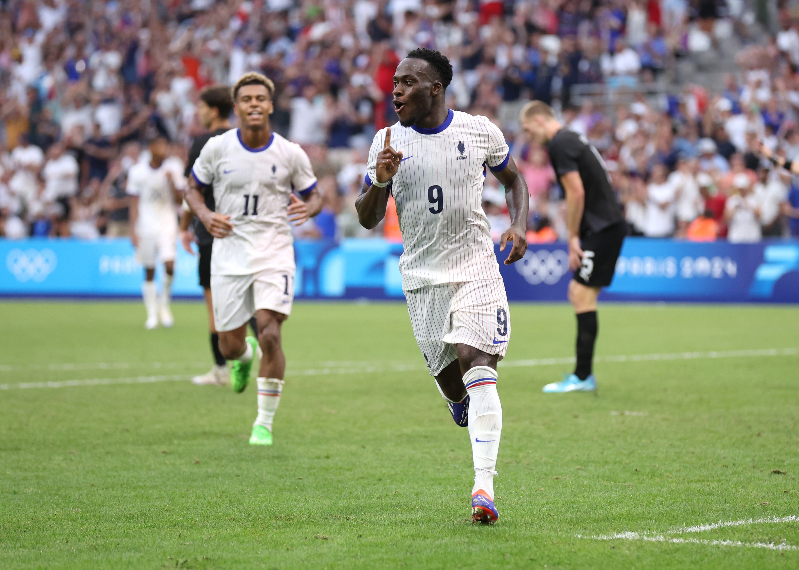 Arnaud Kalimuendo of France celebrates scoring in the Olympic Games