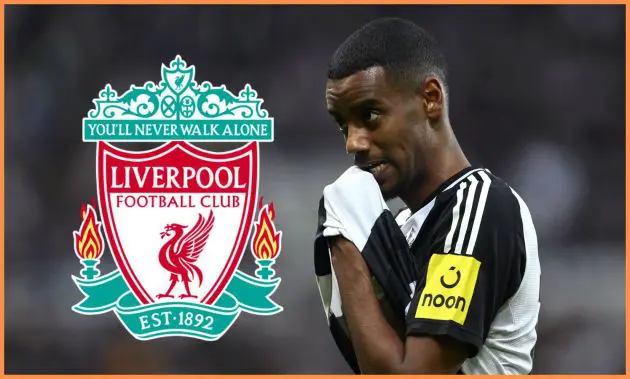 Alexander Isak rubs his face with his shirt next to Liverpool club crest.