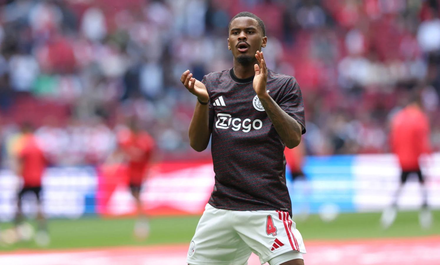 Jorrel Hato applauding the Ajax fans
