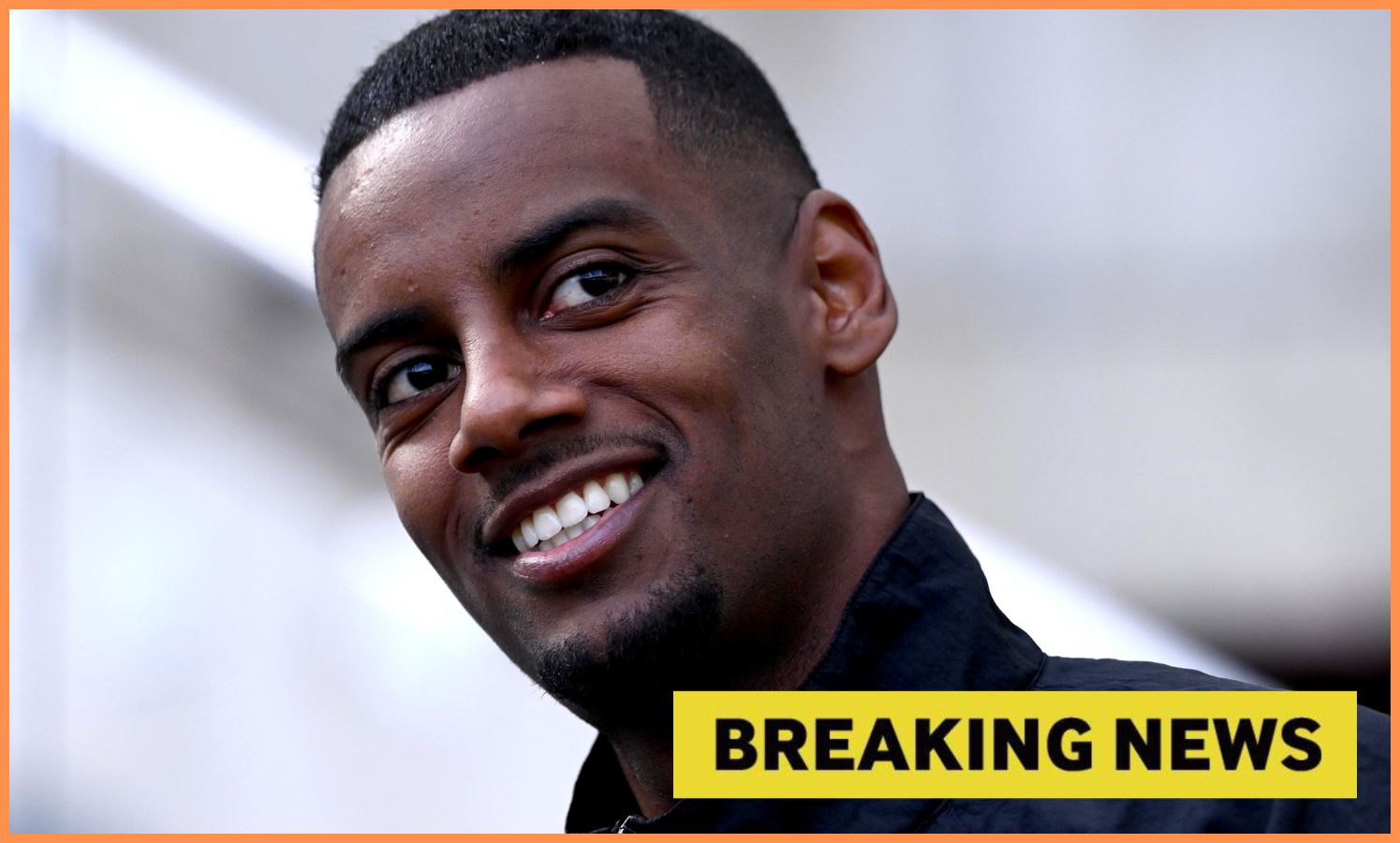 Close-up of Alexander Isak smiling, plus yellow 'breaking news' banner
