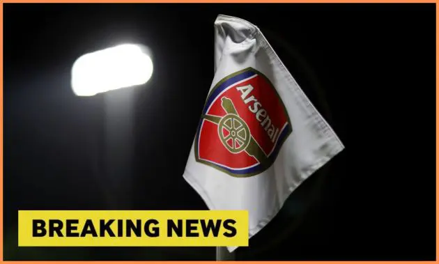 Arsenal logo on corner flag, plus 'breaking news' banner