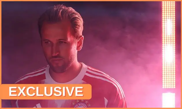 Harry Kane looks on in a cloud of red smoke.