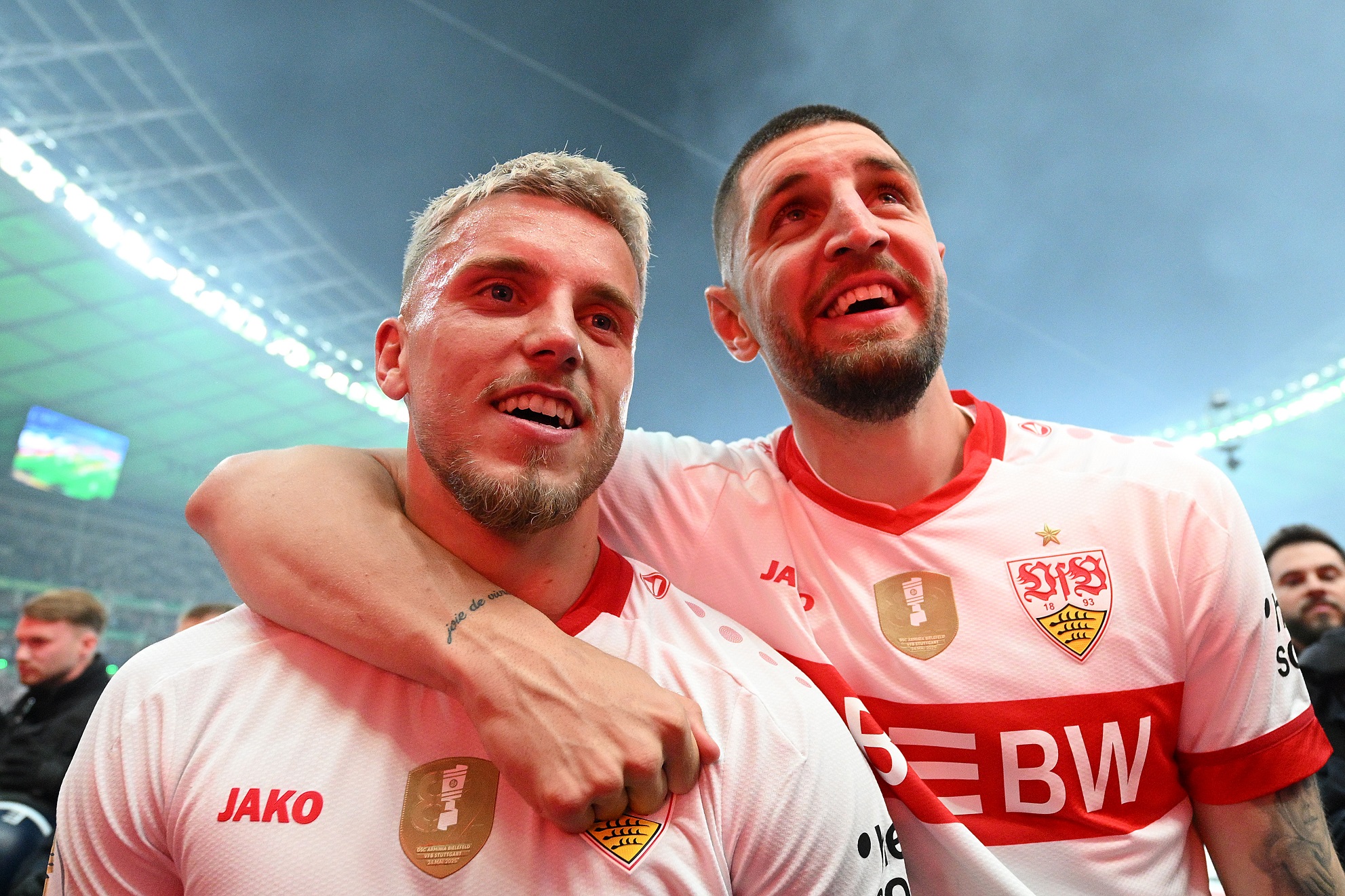Ermedin Demirovic and Jeff Chabot of VfB Stuttgart  