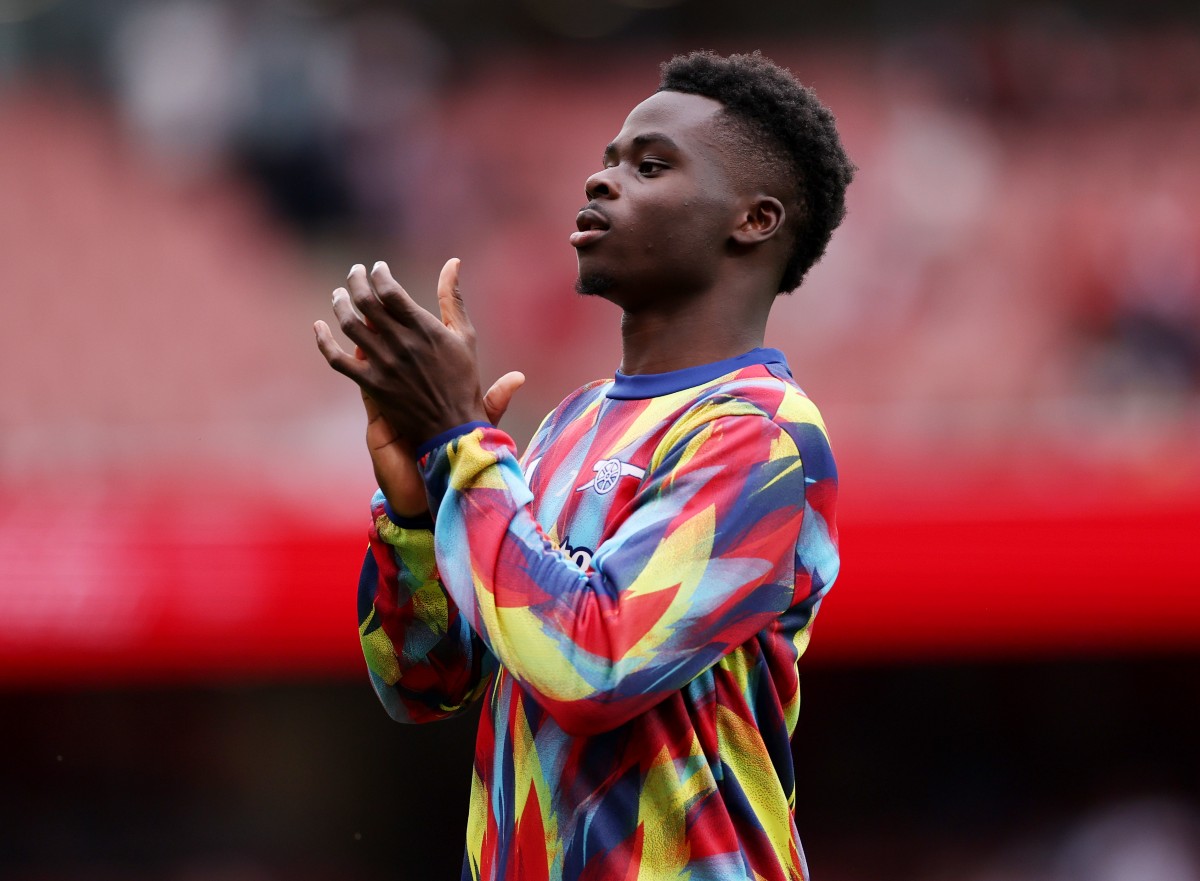 Bukayo Saka applauds the Arsenal fans at the Emirates Stadium