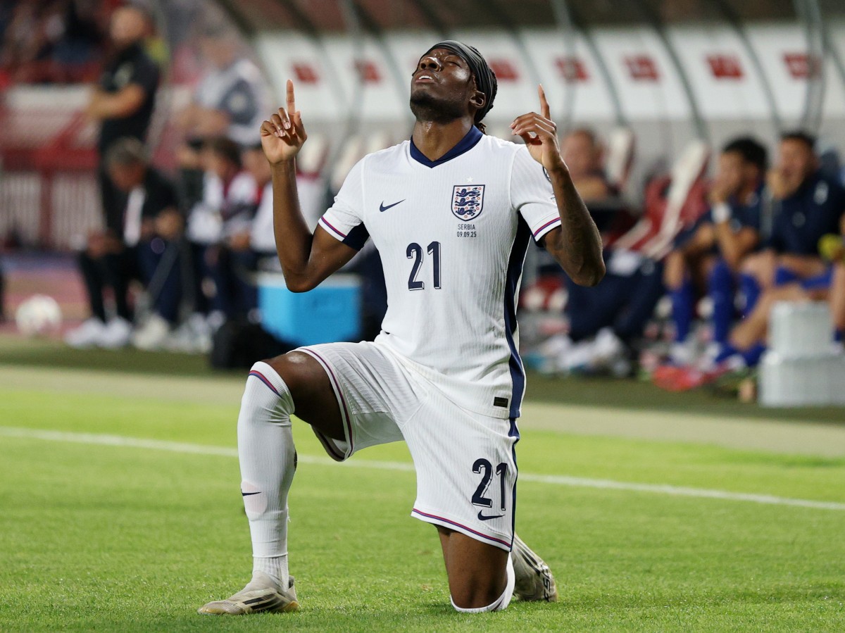 Noni Madueke celebrates scoring for England against Serbia