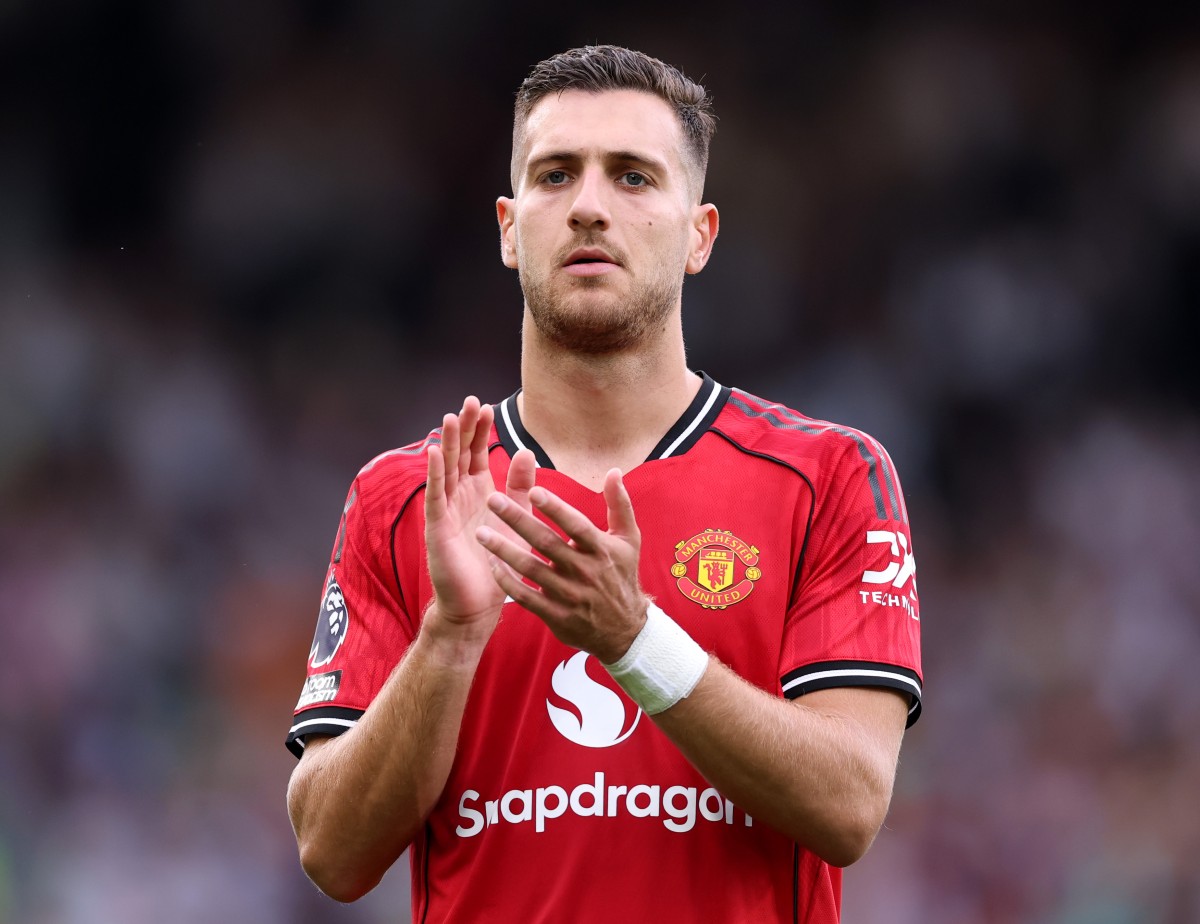 Diogo Dalot applauds the Manchester United fans