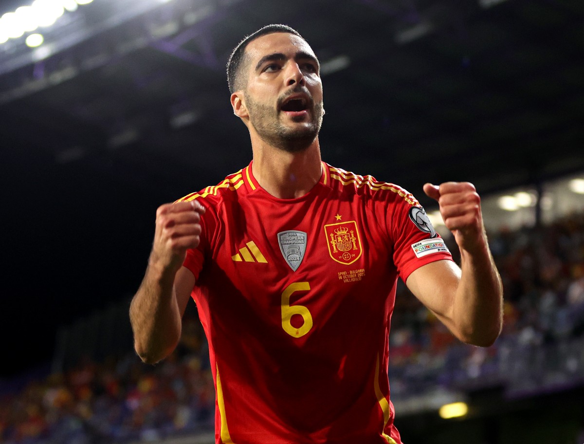 Mikel Merino celebrates scoring for Spain