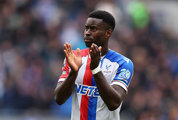 Crystal Palace defender Marc Guehi applauding the fans