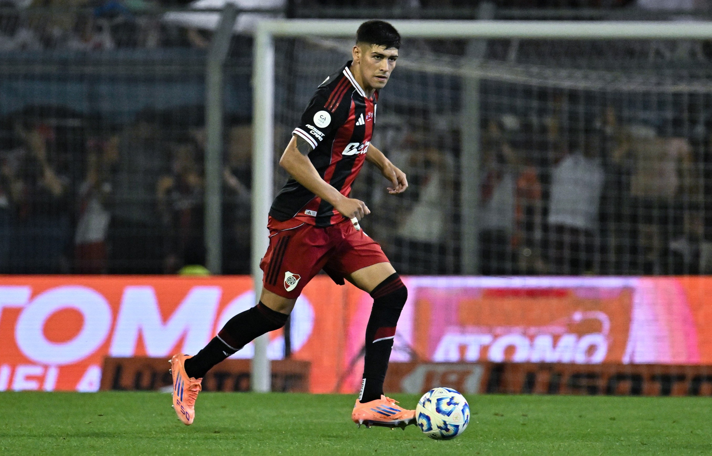 Lautaro Rivero runs with the ball