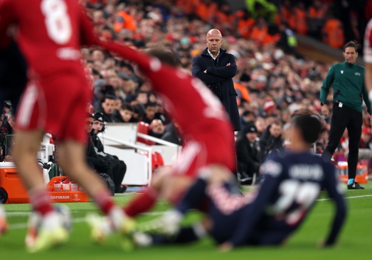 Arne Slot watches on during Liverpool's defeat vs PSV