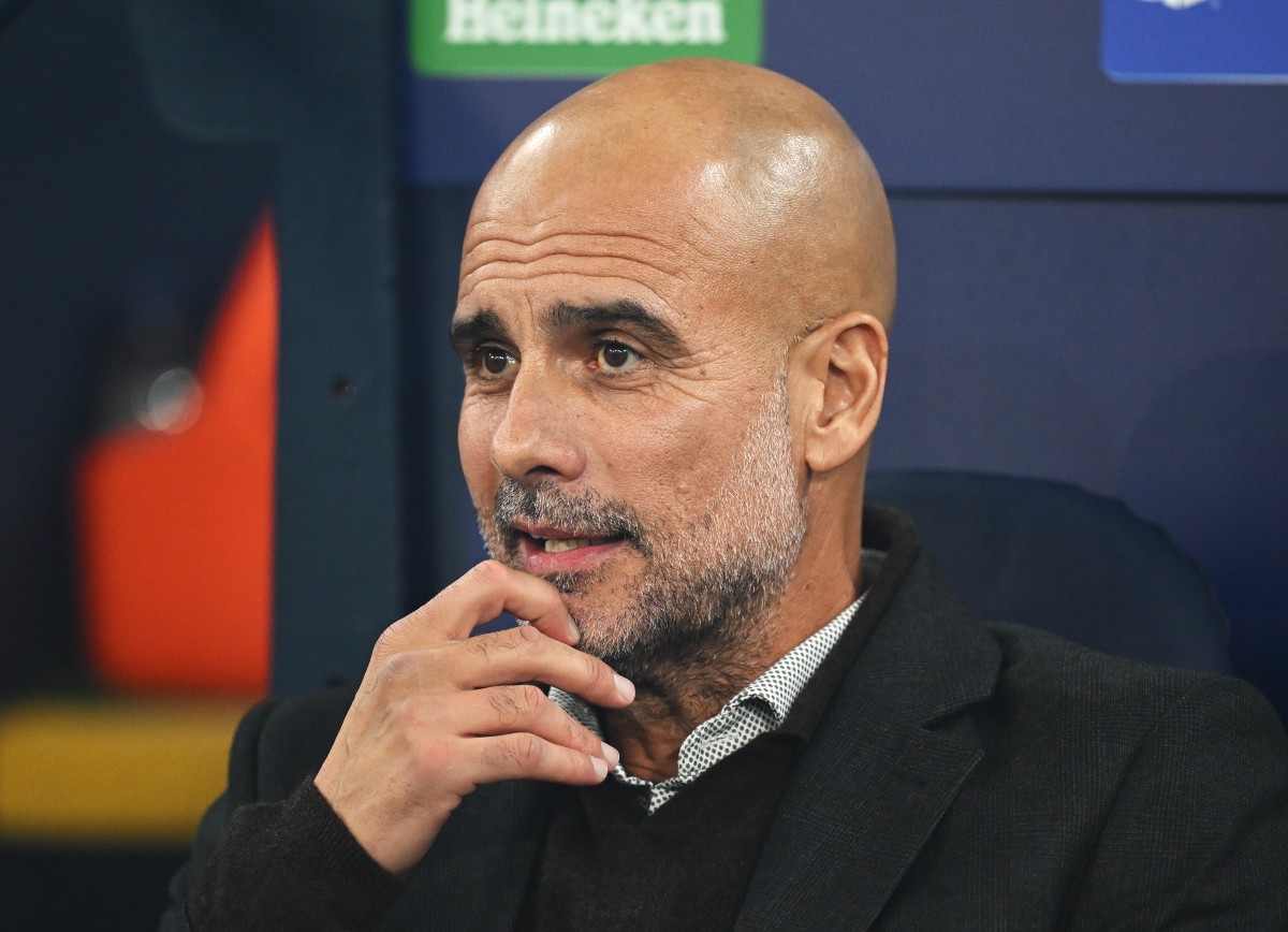 Manchester City manager Pep Guardiola looks on