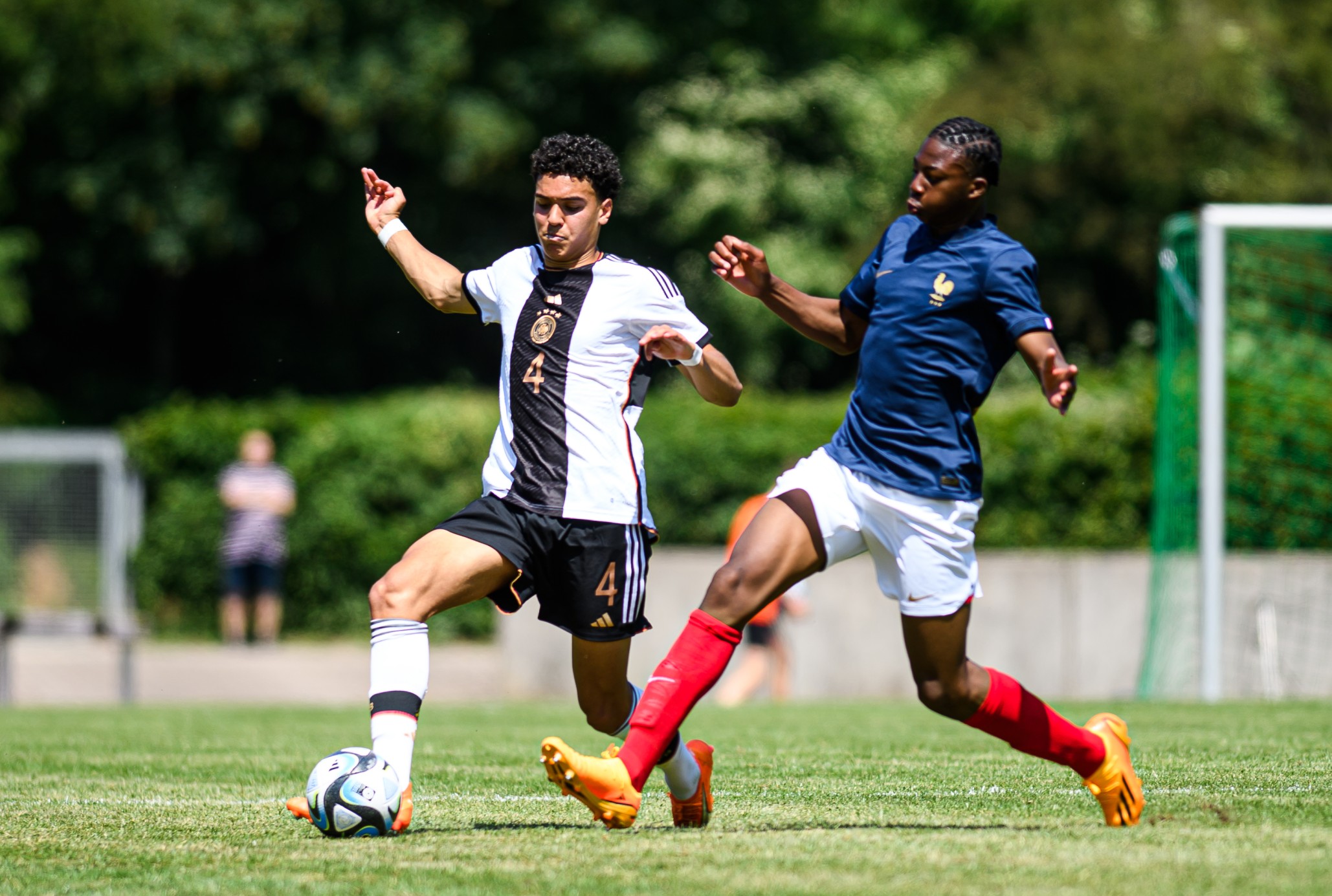 Kader Meite Mohamed of France compete for the ball