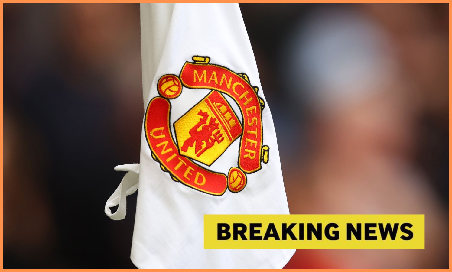 Manchester United logo on corner flag, plus 'breaking news' banner