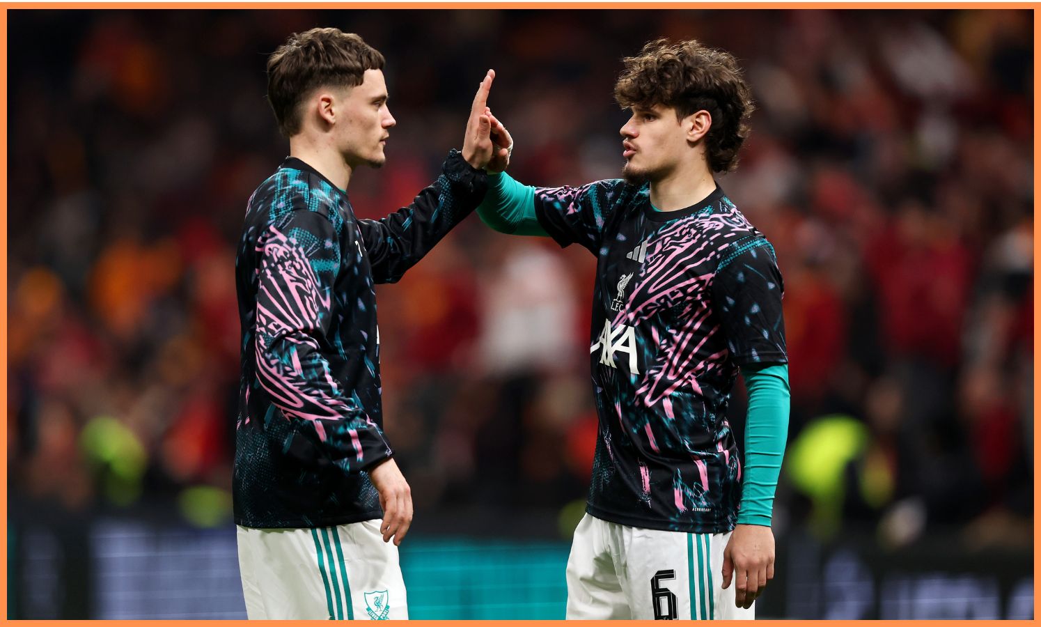 Florian Wirtz with Milos Kerkez in Liverpool's pre-match warm-up